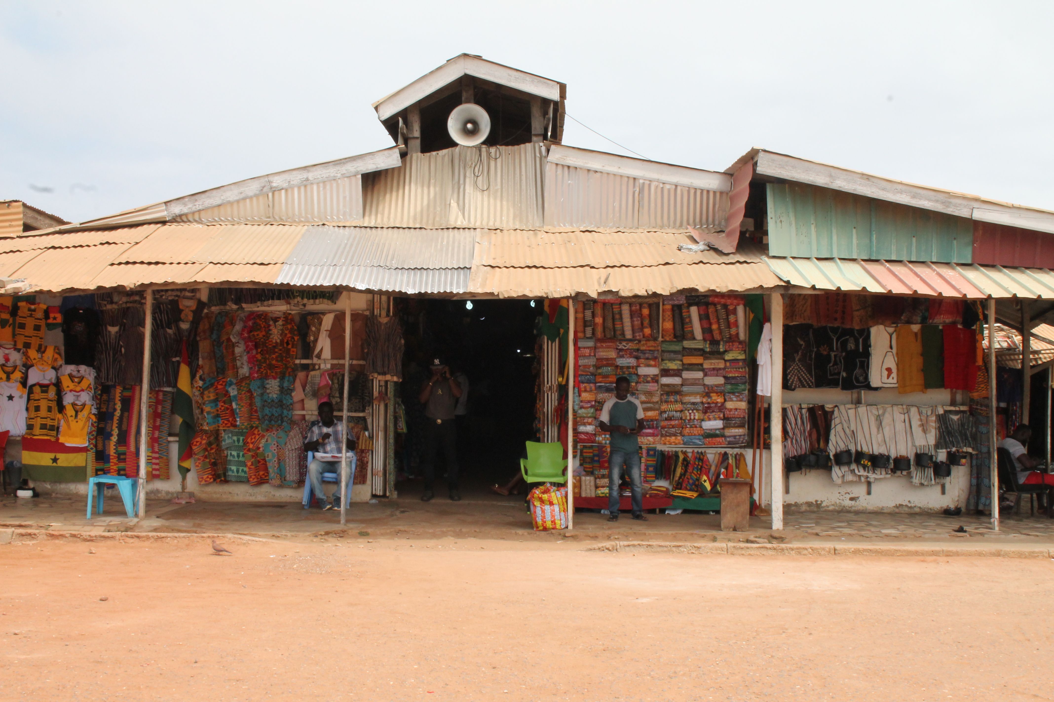 Local color and culture on full display. This bustling Ghanaian market offers vibrant kente cloth, handmade bags, and warm welcomes from community artisans.